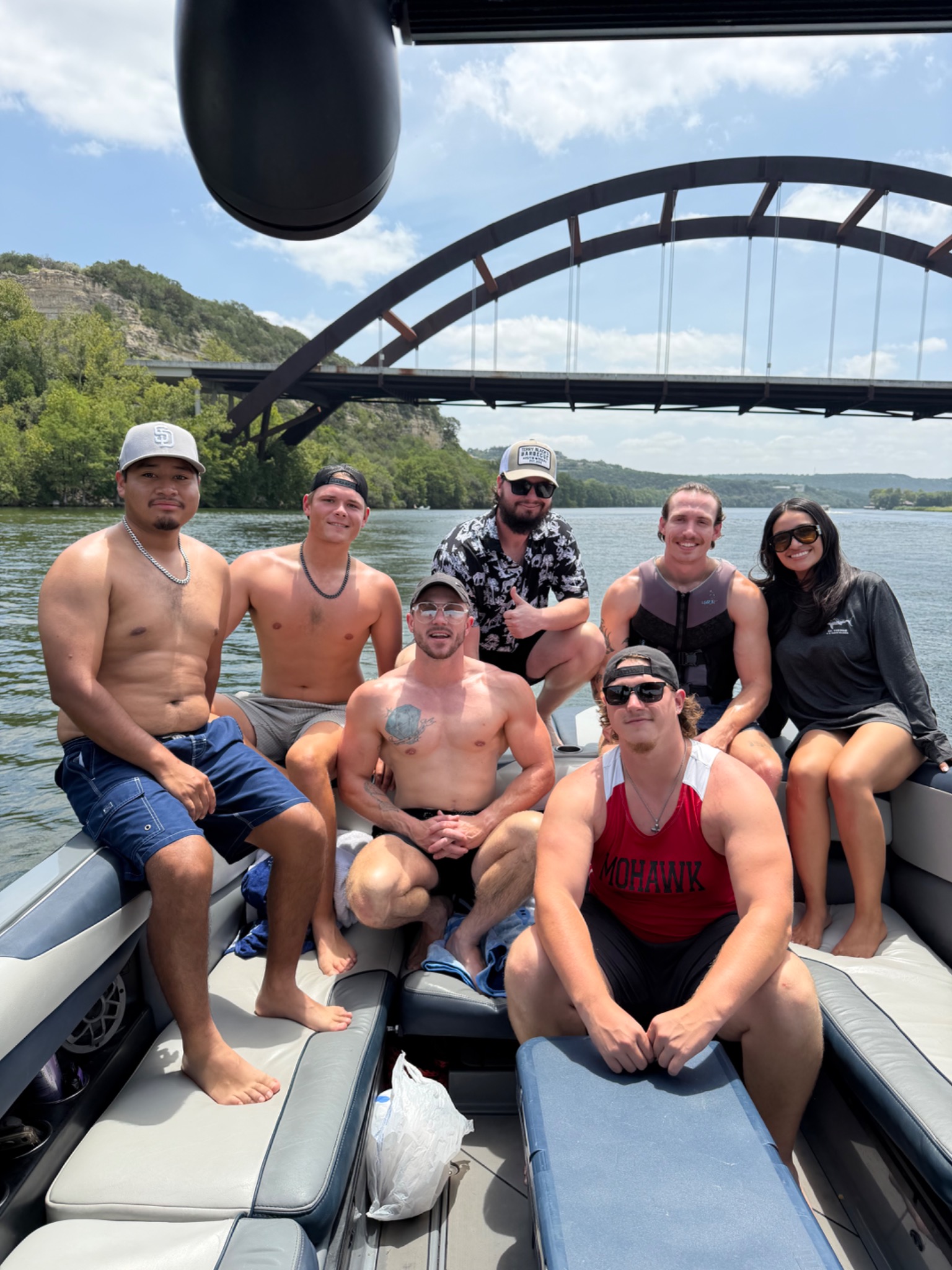 Prodigy Gold team together on a boat during a wakeboarding trip in Austin, Texas