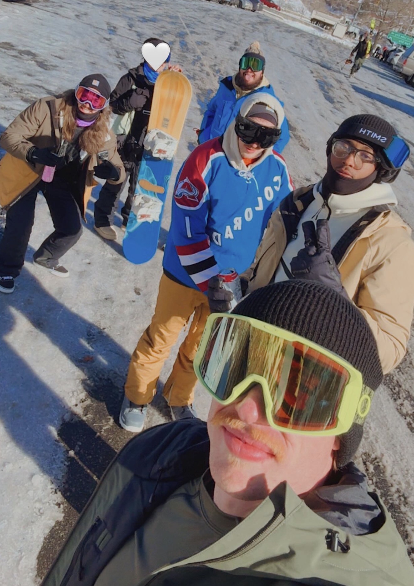 Group selfie with snowboards during the annual Utah team trip